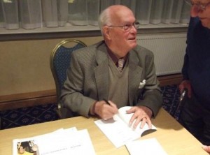 Jimmy Halliday signing a copy of his book “Yours for Scotland” for Paul Scott at the  Scots Independent fringe meeting at the SNP Conference in Inverness in October 2011. Photo Tony Grahame